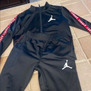 Kids Jordan Black Tracksuit with Red Stripe Detailing